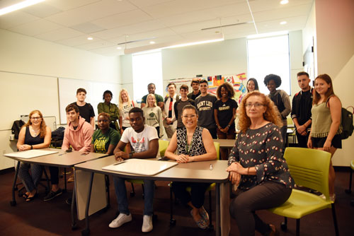 Saint Leo University Bridge Program students with Dr. Marcela Van Olphen, left, seated, and Dr. Iona Sarieva, right, seated.